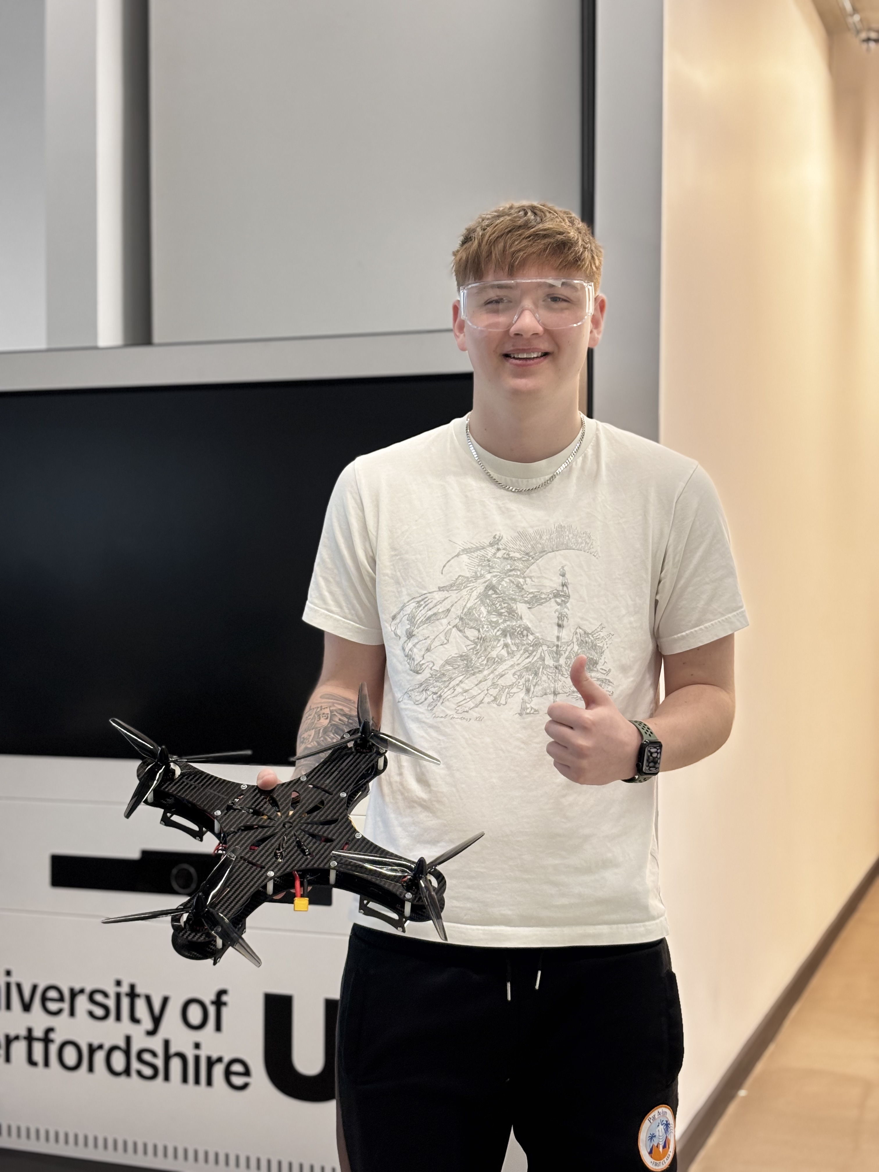 Picture of me and the final Quadcopter UAV